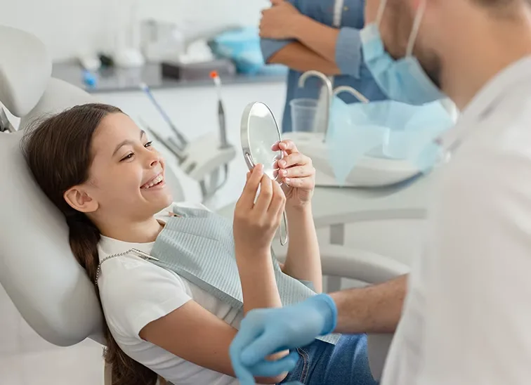 girl smiling in the dental chair