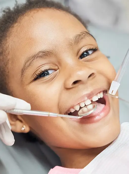Laughing pediatric dentistry patient